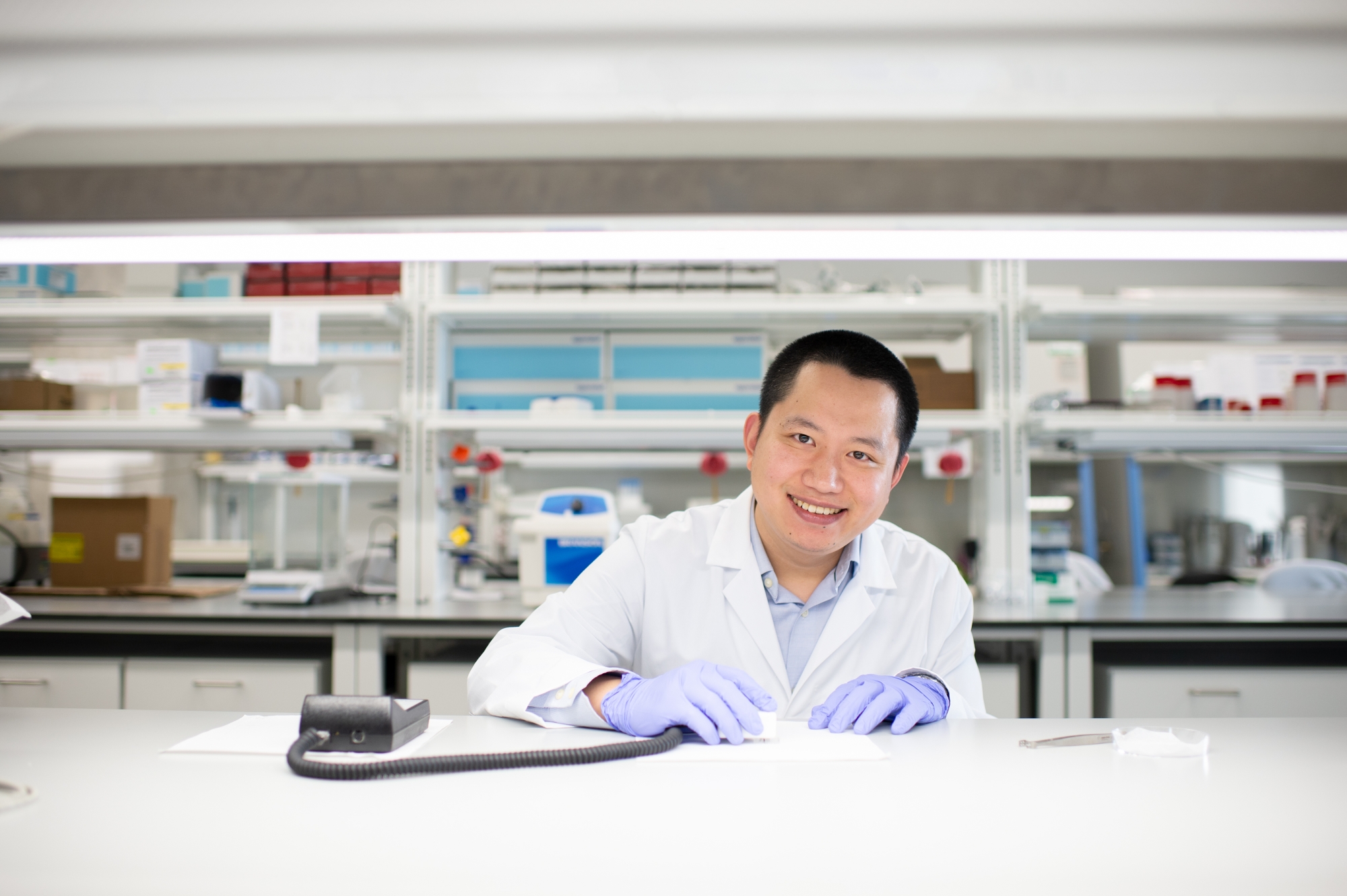Dr. Luyao Lu seated in a lab